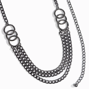 Detailed macro view of multi-layered gunmetal grey chain belt with round metal rings