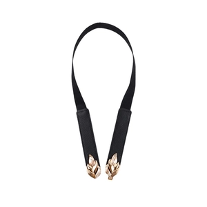 Minimalist elastic waist belt for women with gold leaf buckle and black leather details