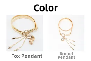 Detail view of gold elastic waist chains with fox and round crystal rhinestone pendants