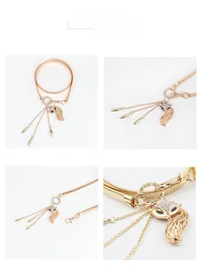 Detail of golden elastic waist chain featuring a diamond-encrusted fox pendant with tassels