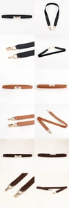 Detail view of thin elastic waist belts in black and brown with golden metal hooks
