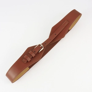 Close-up of brown elastic waist belt with gold metal buckle and faux leather detail