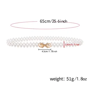 Chaîne de taille élégante en perles blanches avec boucle dorée en nœud et strass