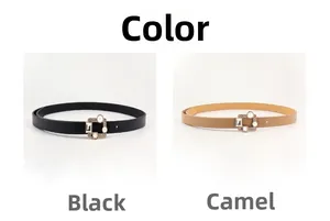 Close-up of black and camel skinny PU leather belts with square rhinestone buckles