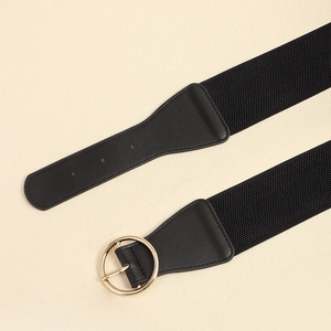 Elastic black waist belt with classic round gold buckle for elegant shirt and dress styling