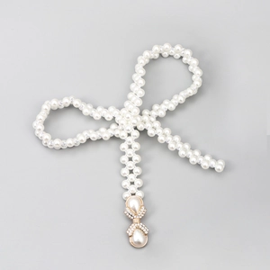Chaîne de taille élégante en perles avec nœud et boucle dorée pour robes chic