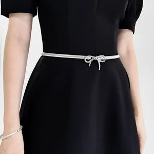 Elegant silver bow buckle elastic metal waist chain for women on black dress