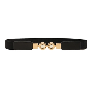 Elastic black waist belt for women with interlocking gold metal buckle on white background