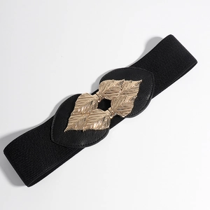 Detail of elegant black elastic waist belt featuring golden leaf-shaped metal buckle on white base