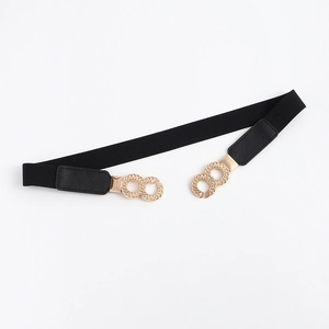 Detailed view of women's black elastic waist belt with gold interlocking rings buckle