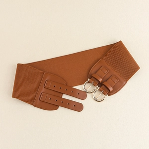 Detail view of caramel brown elastic wide belt with double silver metal buckles