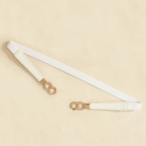 Close-up of a white elastic waist belt featuring a gold chain-link style metal buckle