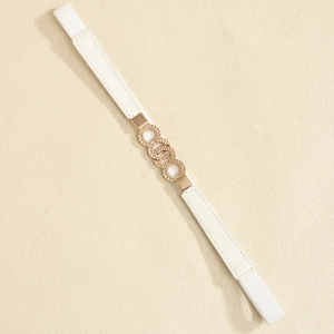 Detailed macro view of an elastic white waist belt featuring a gold braided metal buckle