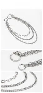 Detailed macro view of triple-layered silver punk waist chains with spring ring clasps