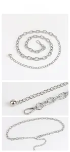 Detail of silver alloy waist chain showing lobster clasp, link texture, and decorative metal ball