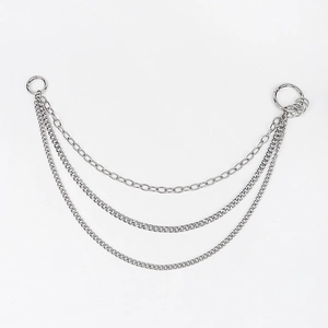 Detail of silver multi-layer punk waist chain with three metal links and spring clasps