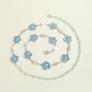 Elegant silver waist chain with light blue crystal flower charms and white zircon accents