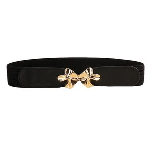 Women's black elastic waist belt with a golden mushroom-shaped buckle for dresses