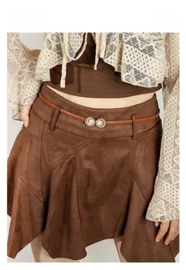 Close-up of pearl buckle on brown suede skirt belt for women vintage daily outfit detail