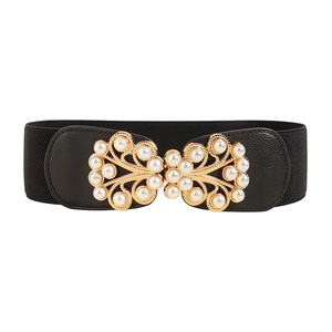 Elegant black elastic waist belt with gold filigree buckle and white pearl accents