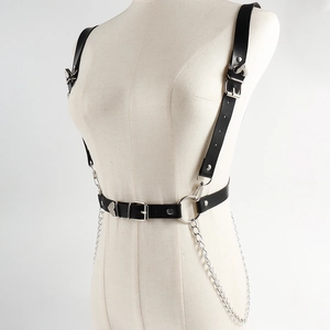 Detail of punk style PU leather body harness with silver chains and adjustable buckles