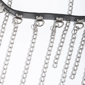 Detailed macro view of black PU leather belt featuring multi-layer silver metal chain fringes