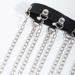 Close-up of black PU leather punk garter with silver metal chains and D-ring details