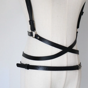 Fashionable black leather body harness with silver metal rings and adjustable straps