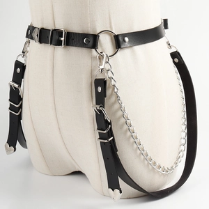 Detail of Harajuku punk PU leather body chain belt with silver metal heart pendants