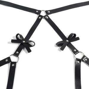 Punk black leather body harness with silver rings and decorative bowknot details