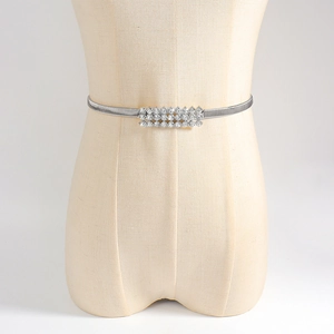 Detail of silver elastic spring waist chain with triple row rhinestone buckle centerpiece