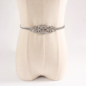 Detail of silver elastic spring waist chain featuring vintage镂空filigree buckle