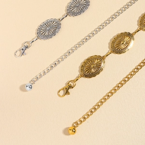 Bohemian vintage metal waist belts in gold and silver with sunburst oval patterns