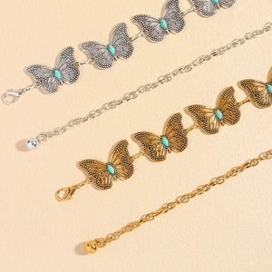 Vintage metal butterfly waist chain in gold and silver finish with turquoise stone accents
