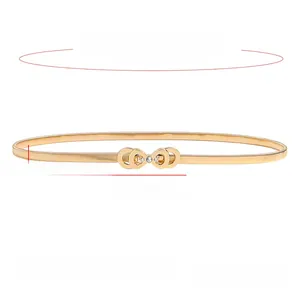 Detailansicht der elastischen goldfarbenen Federkette mit Strass-Schleife und Maßen