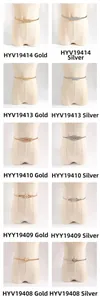 Detail view of stylish gold and silver thin spring waist chains with rhinestone buckles