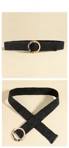 Detail of black woven elastic belt with vintage tiger-patterned resin round buckle