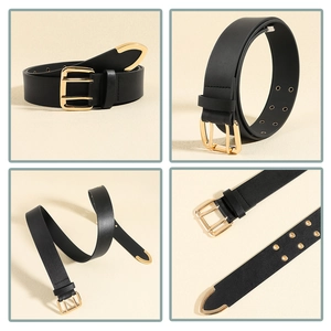 Detail of black leather belt with gold double-buckle and retro metal tip accents