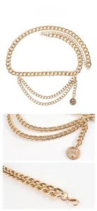 Detailed macro view of the multi-layered gold metal waist chain and coin pendant
