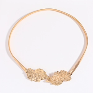 Elastic gold waist chain belt featuring detailed leaf buckle for women dresses