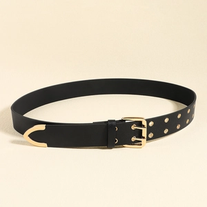 Close-up of black matte waist belt with double gold pin buckle and metal eyelets
