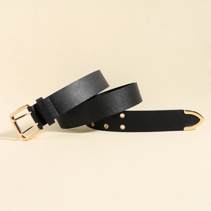Detail of black leather belt featuring golden square double pin buckle and metal eyelets