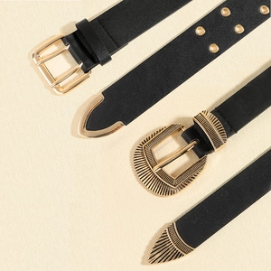 Black western style belts with golden metal pin buckles and vintage embossed details