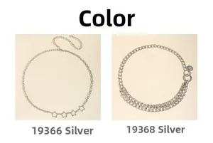 Detail of silver star pendants and smiley face charm on double-layer metal waist chains