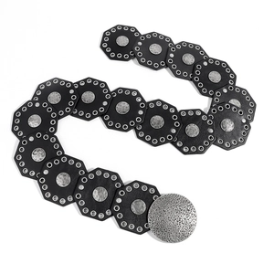 Close-up of vintage wide waist belt with black octagonal plates and silver hammer finish buckles