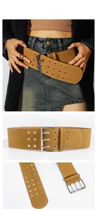 Close-up of vintage wide velvet belt with triple-prong buckle and silver eyelet details