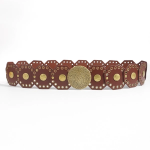 Detail of vintage brown leather waist belt with octagonal panels and gold studs