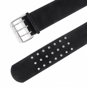 Detail of wide black punk velvet belt featuring triple-row silver metal eyelets and 4-prong buckle