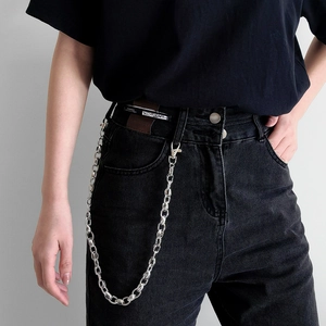 Close-up of hip hop style double layered silver metal pants chain on black jeans
