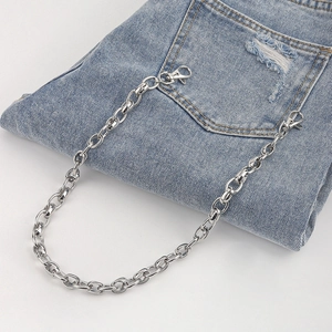 Silver dual-layered metal pant chain with lobster clasps styled on blue denim pockets